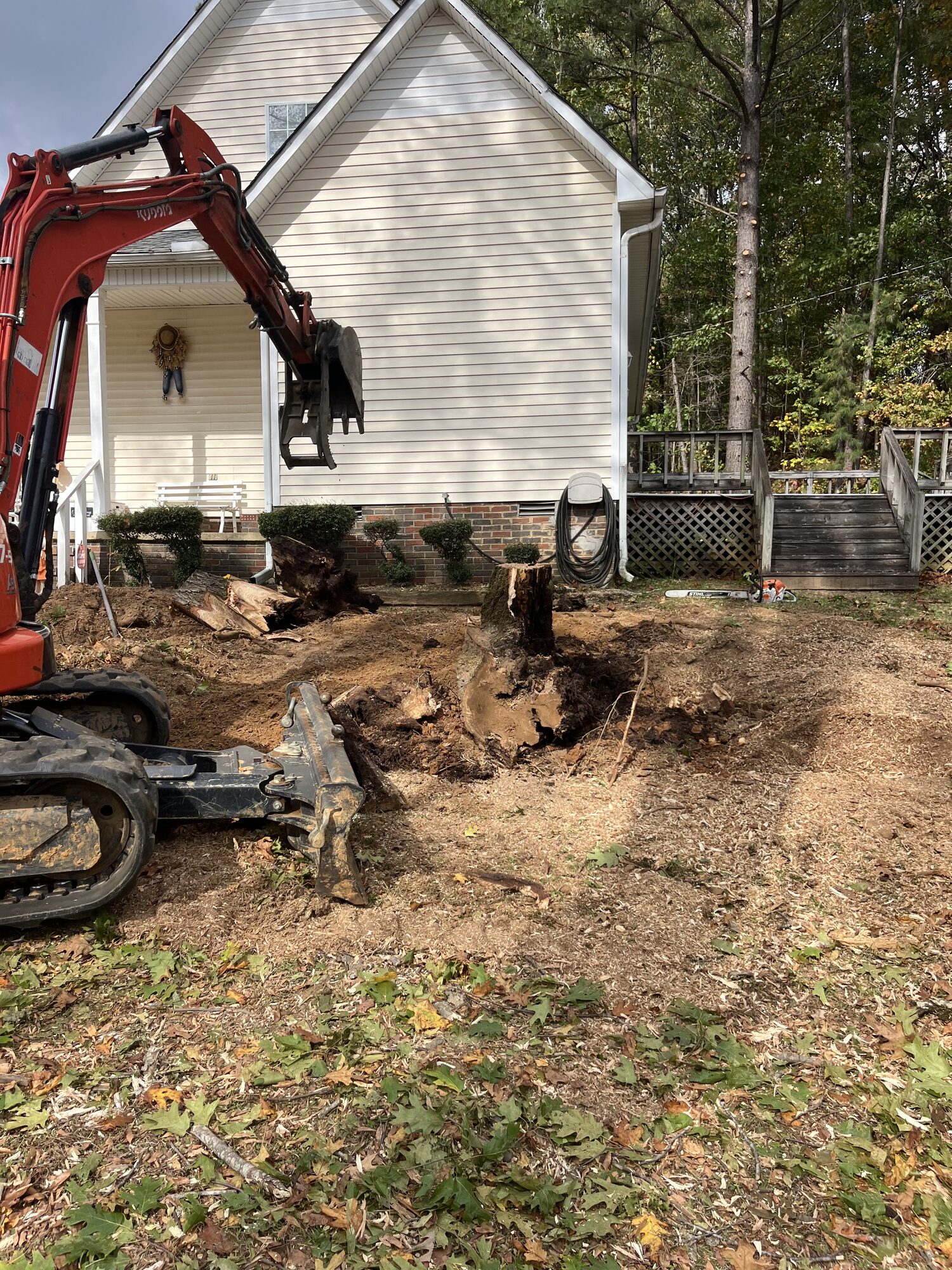 Stump removal excavation tight to a home foundation in Selmer TN