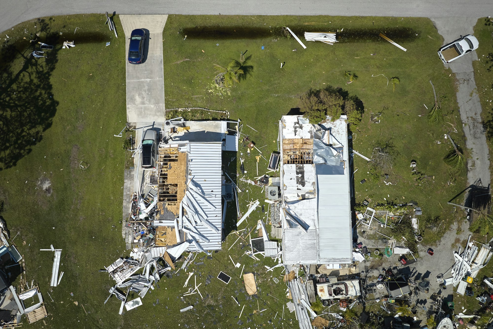 Hurricane Ian destroyed homes in Florida residential area. Natural disaster and its consequences